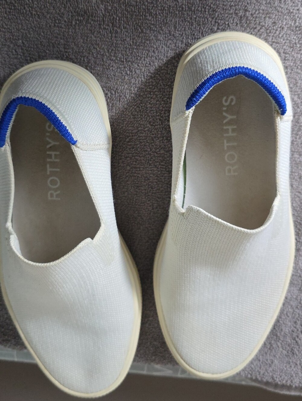 Rothy's Slip-On Knit Sneakers in White with Blue Heel Trim